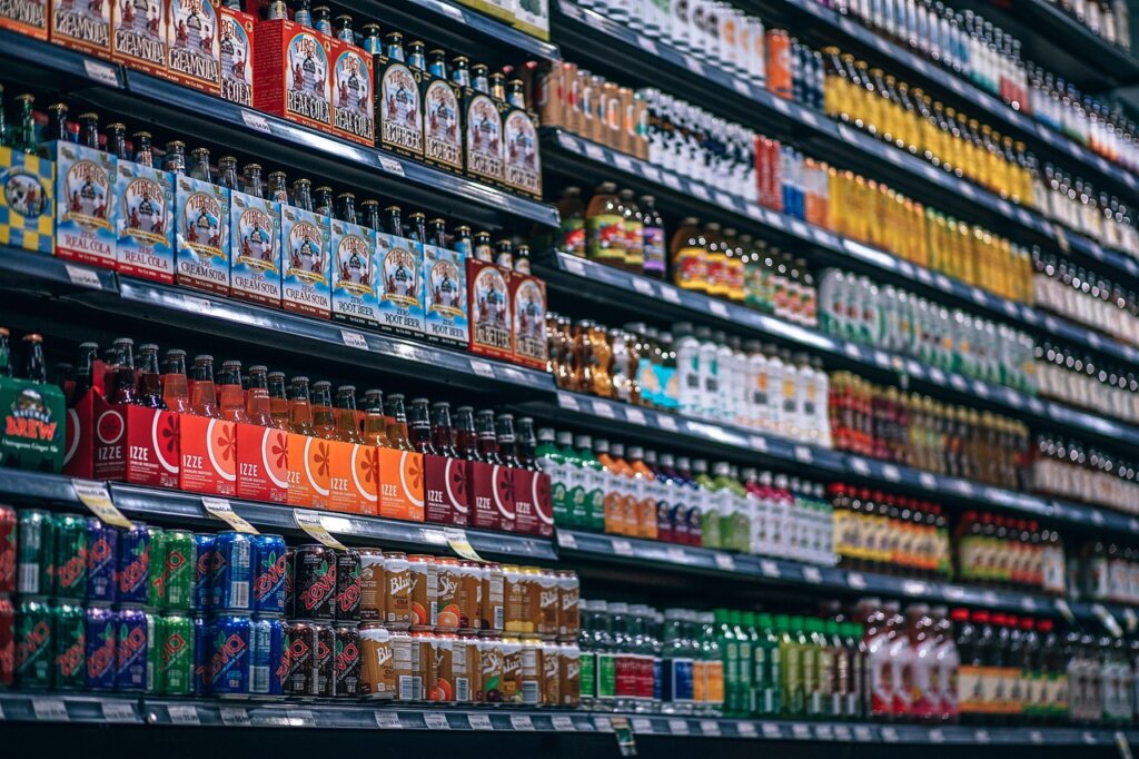 comparison of citric acid, baking soda, and bleach bottles on shelf