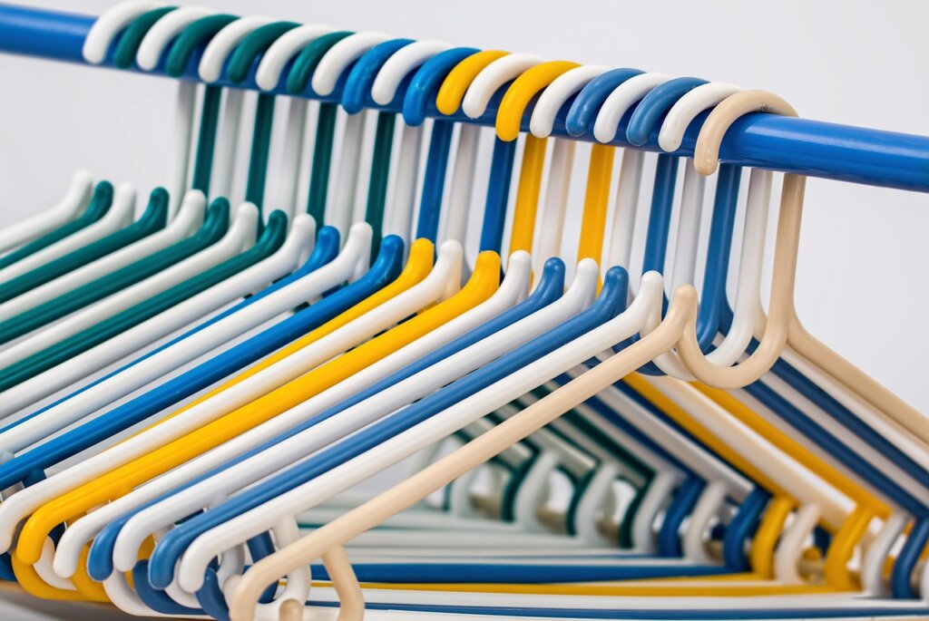 slim velvet hangers organized closet in small apartment