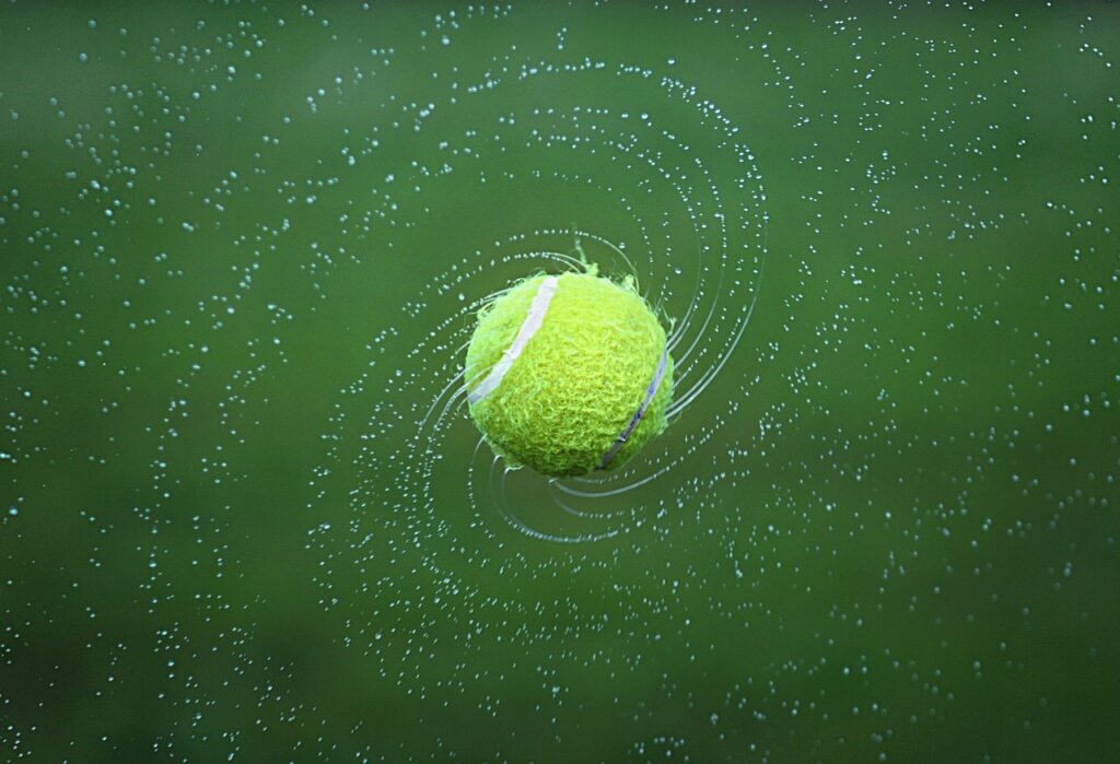 down comforter with tennis balls inside dryer drum