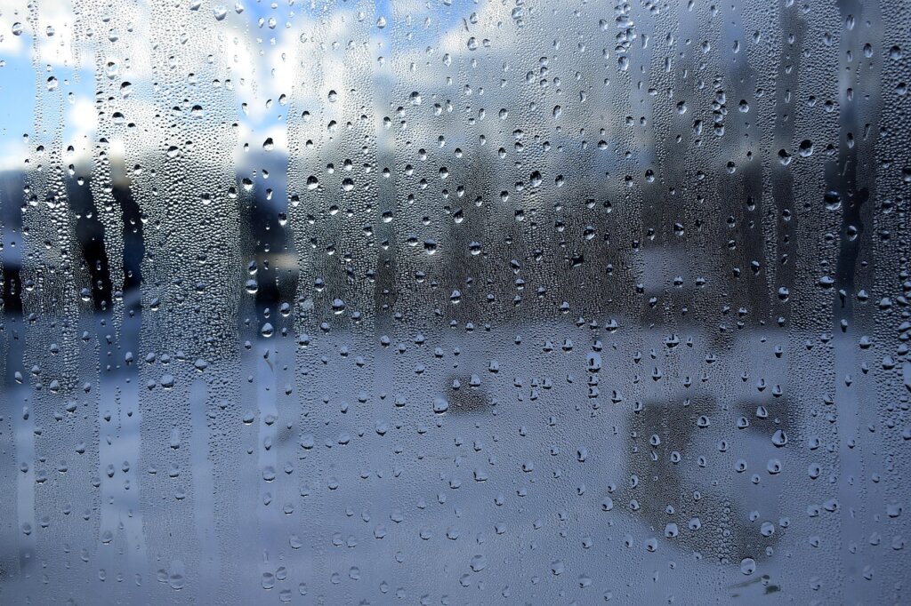 duvet airing on a drying rack near a window with natural breeze