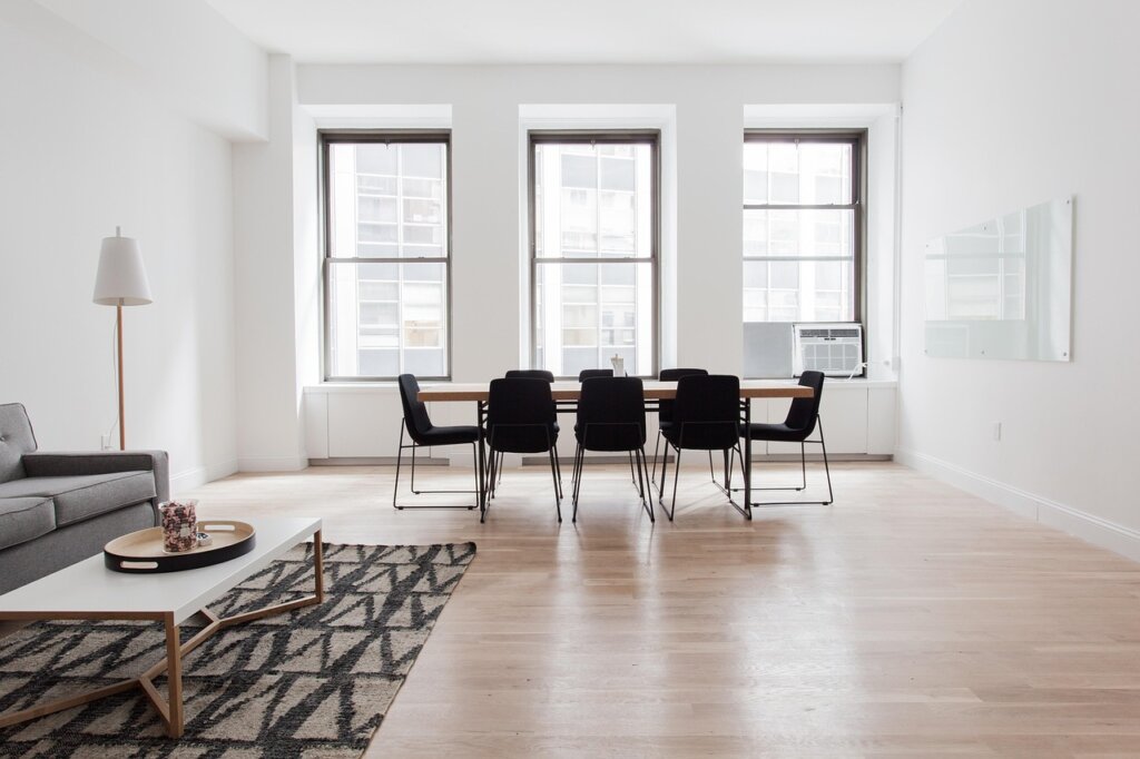 replacing fabric carpet with small rug in living room