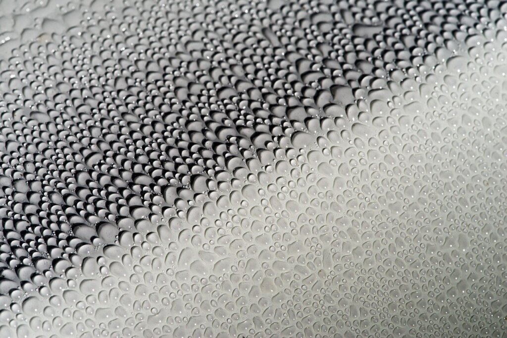 water beading on treated glass window after hydrophobic coating application