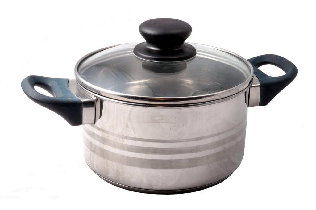 baking soda paste applied to burnt stains on stainless steel pot bottom, scrubbing with soft sponge