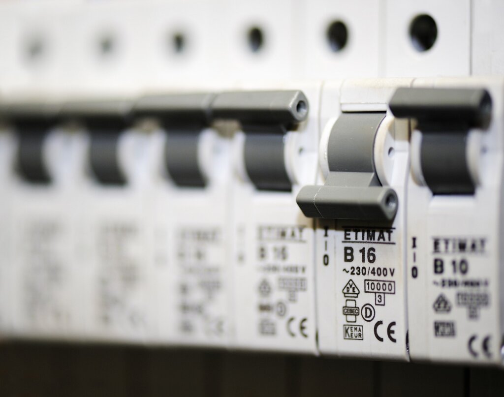 electrical circuit breaker panel being switched off before bathroom cleaning