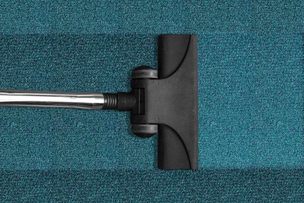 fabric protector spray being applied to clean carpet