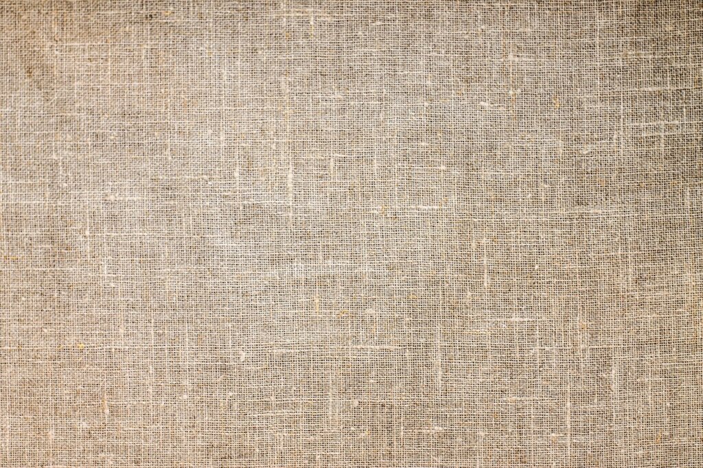 blotting coffee stain on beige sofa with white cloth