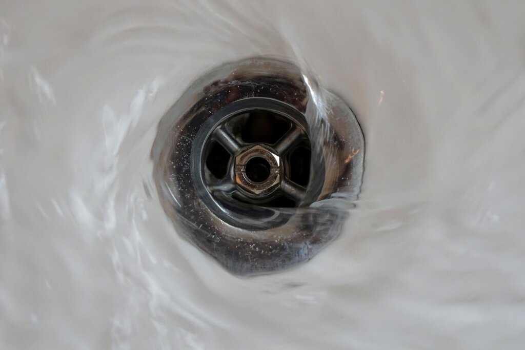 baking soda and vinegar poured into sink drain