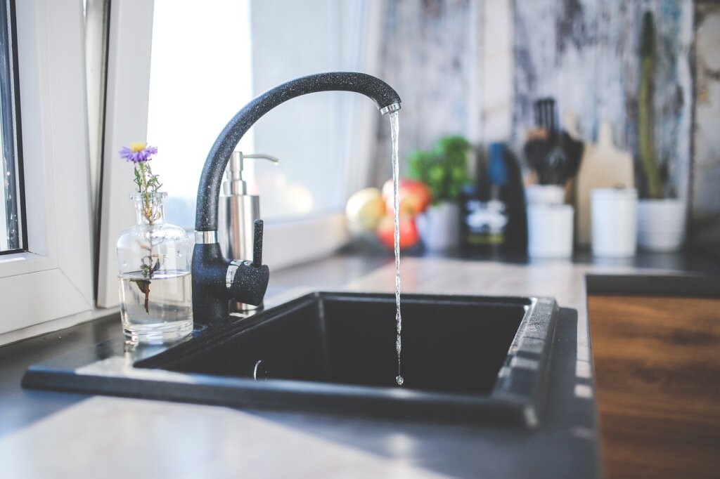 kitchen drain trap pipe under sink cabinet