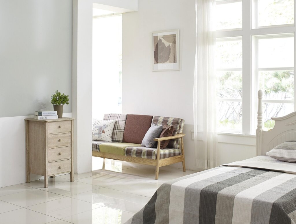 new couple checking air purifier filter in living room