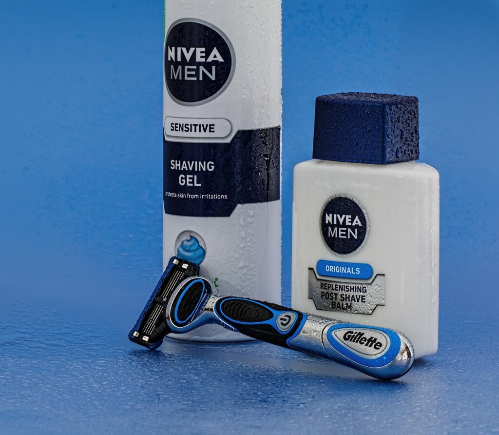 three bathroom cleaning products placed on white tile floor