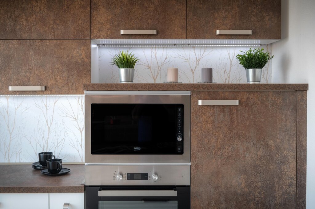 microwave oven with wet kitchen towel inside, timer running