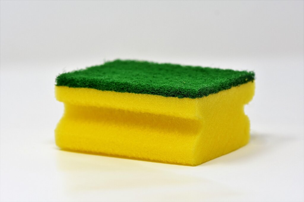 melamine sponge cleaning greasy handprint marks on wallpaper near light switch