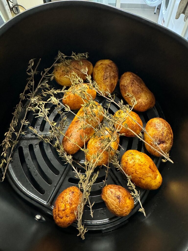 air fryer basket with grease buildup before cleaning
